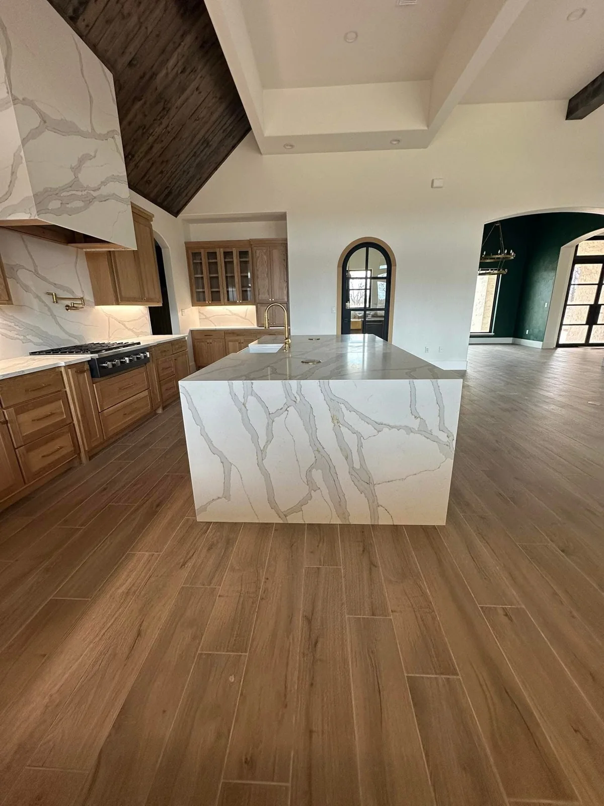 Wood-look tile throughout an open kitchen and living space