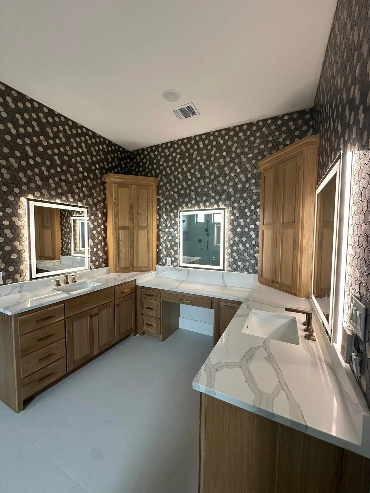 Custom kitchen with wood-look tile and stone surfaces